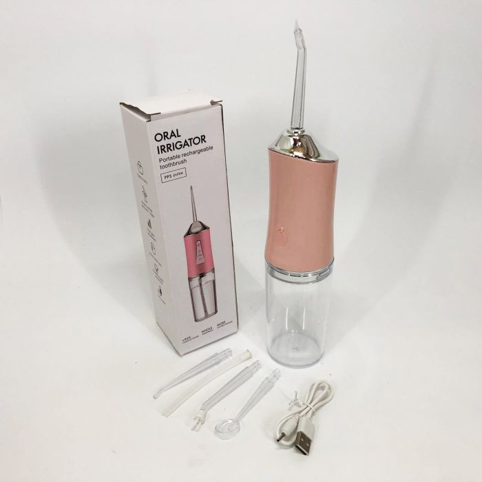 Ирригатор для чистки зубов и полости рта Oral Irrigator с аккумулятором и сменными насадками. Цвет: розовый