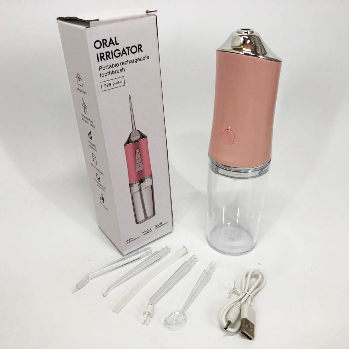 Ирригатор для чистки зубов и полости рта Oral Irrigator с аккумулятором и сменными насадками. Цвет: розовый