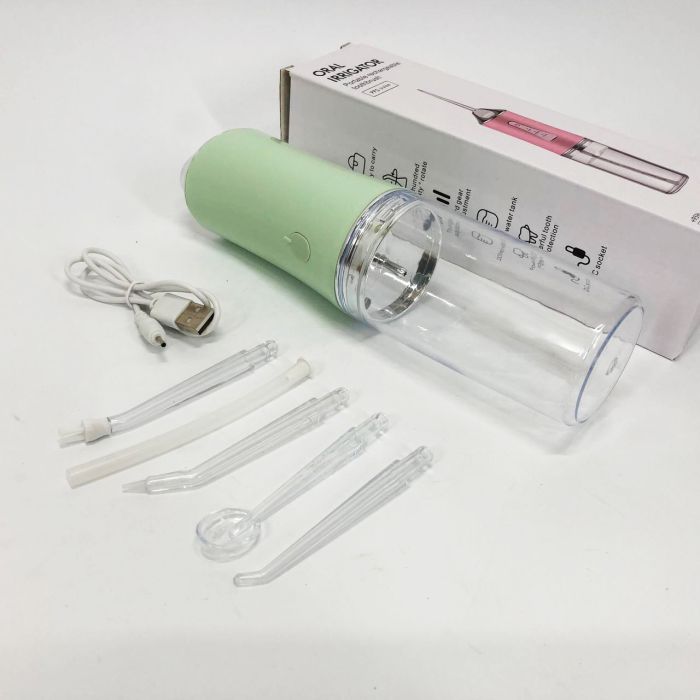 Ирригатор для чистки зубов и полости рта Oral Irrigator с аккумулятором и сменными насадками. Цвет: зеленый