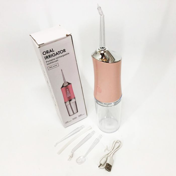 Ирригатор для чистки зубов и полости рта Oral Irrigator с аккумулятором и сменными насадками. Цвет: розовый