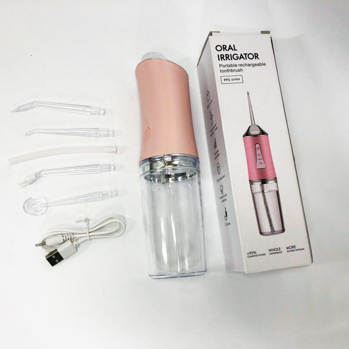 Ирригатор для чистки зубов и полости рта Oral Irrigator с аккумулятором и сменными насадками. Цвет: розовый