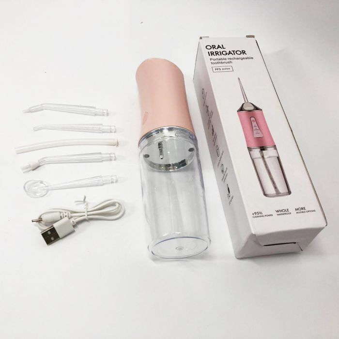Ирригатор для чистки зубов и полости рта Oral Irrigator с аккумулятором и сменными насадками. Цвет: розовый